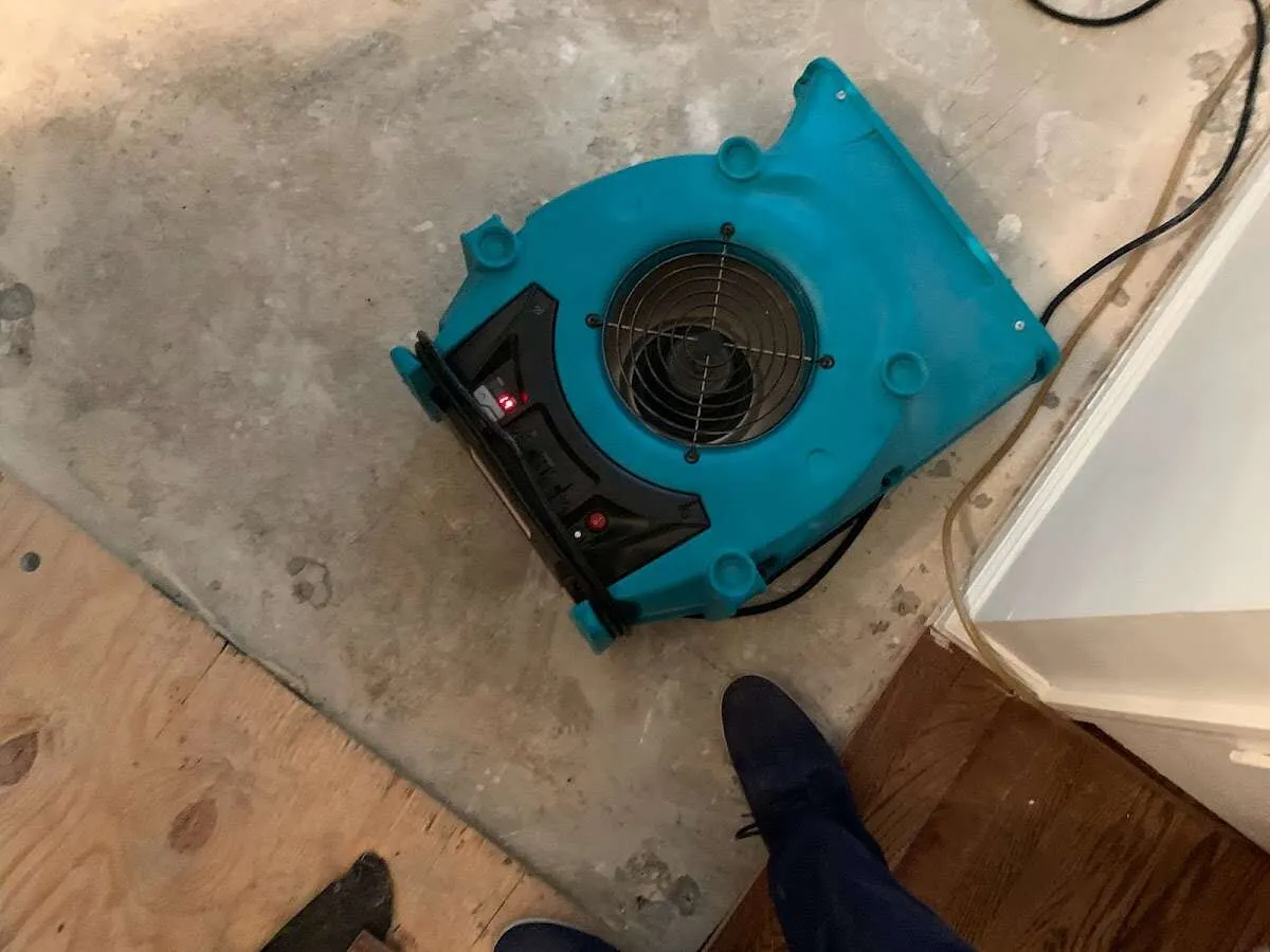 Air mover drying subfloor during Commercial Water Damage Restoration in Stevenson Ranch